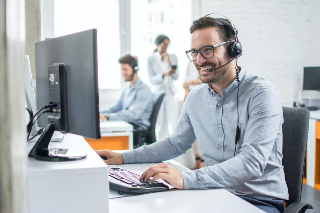 Smiling customer support person with headset